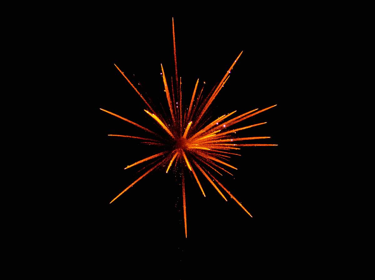 night red and orange fireworks in black background outdoors