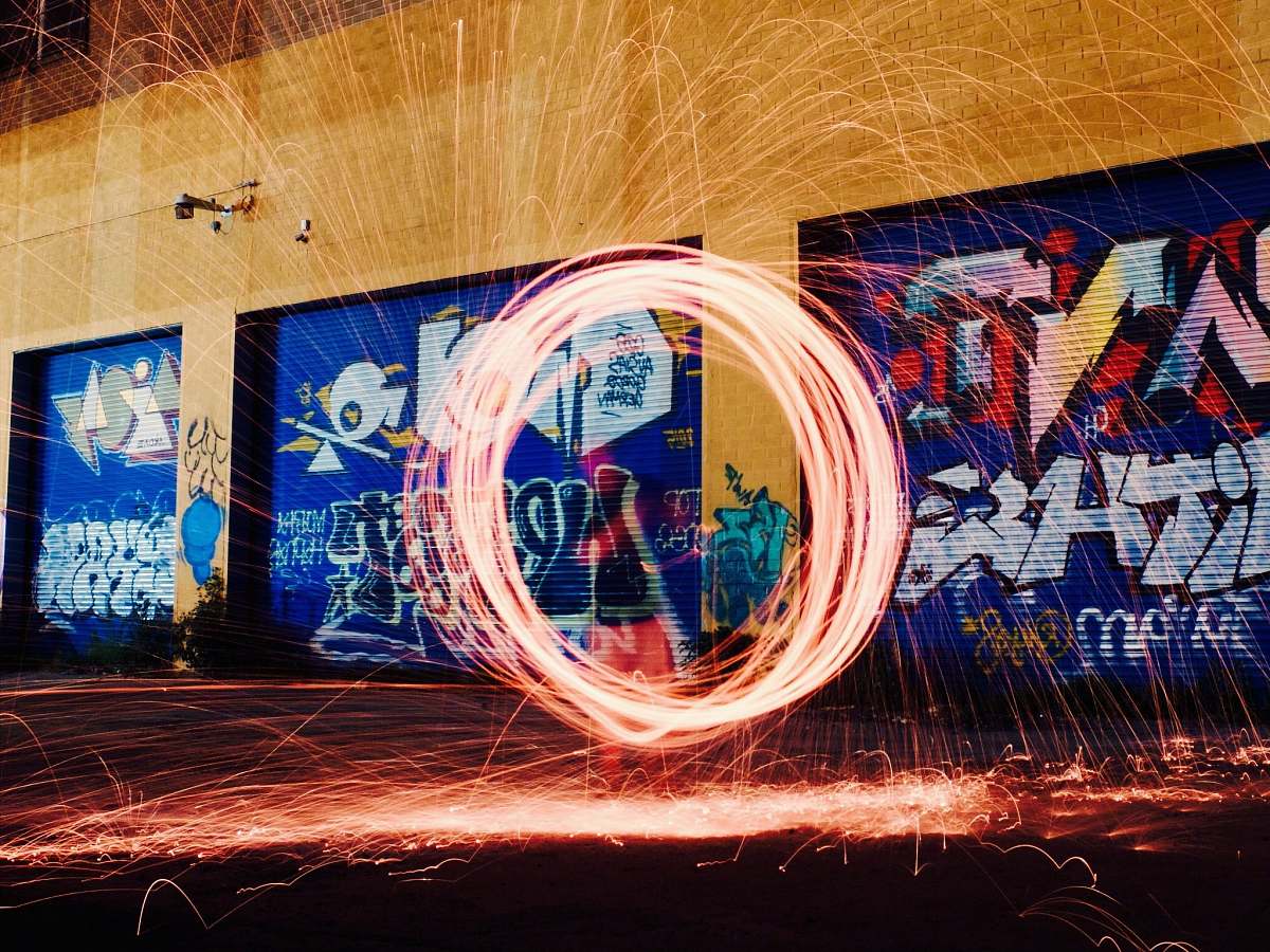 graffiti time-lapse photography of woman using steel wool new york