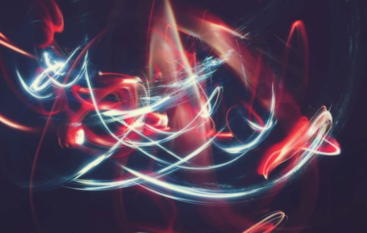 light time-lapsed photo of white and red light plasma