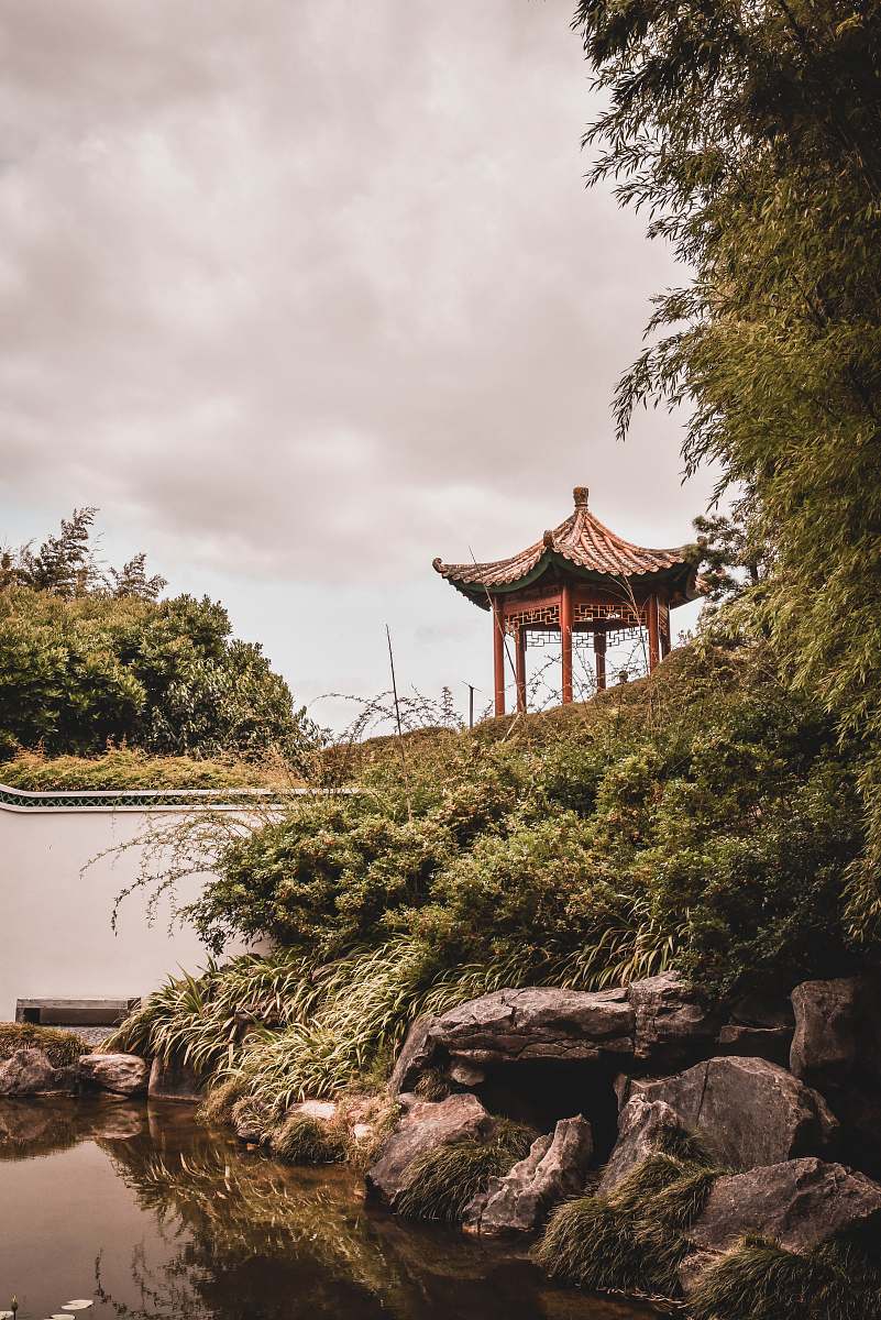 architecture brown pagoda near trees under white sky tree