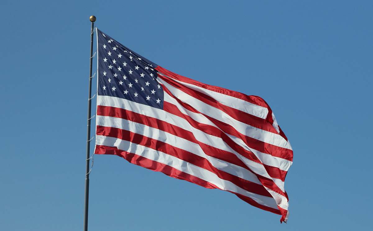 symbol USA flag under clear blue sky american flag