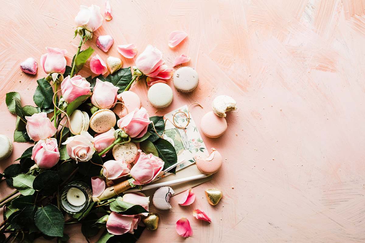 food flat-lay photography of macaroons and pink rose flowers pink