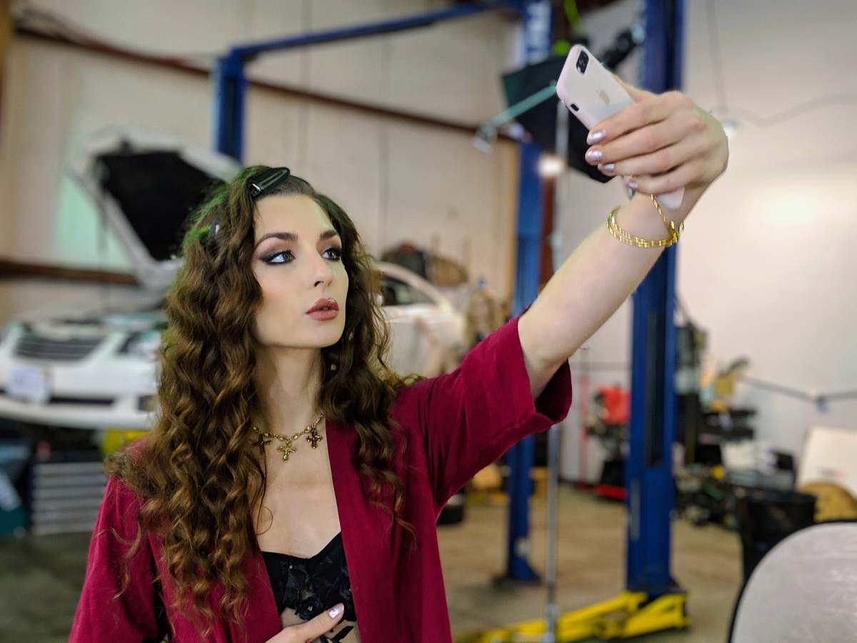person selective focus photo of woman taking selfie sterling