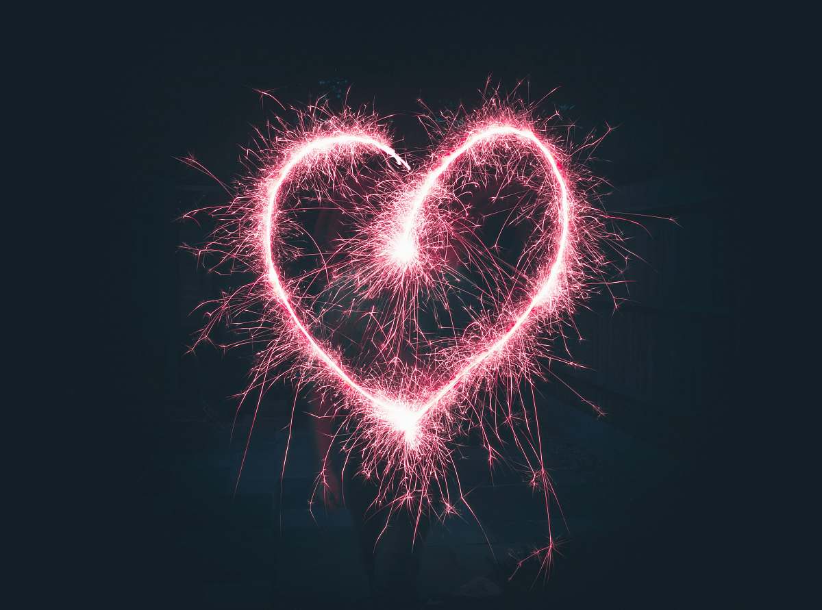 night heart shaped pink sparklers photography outdoors