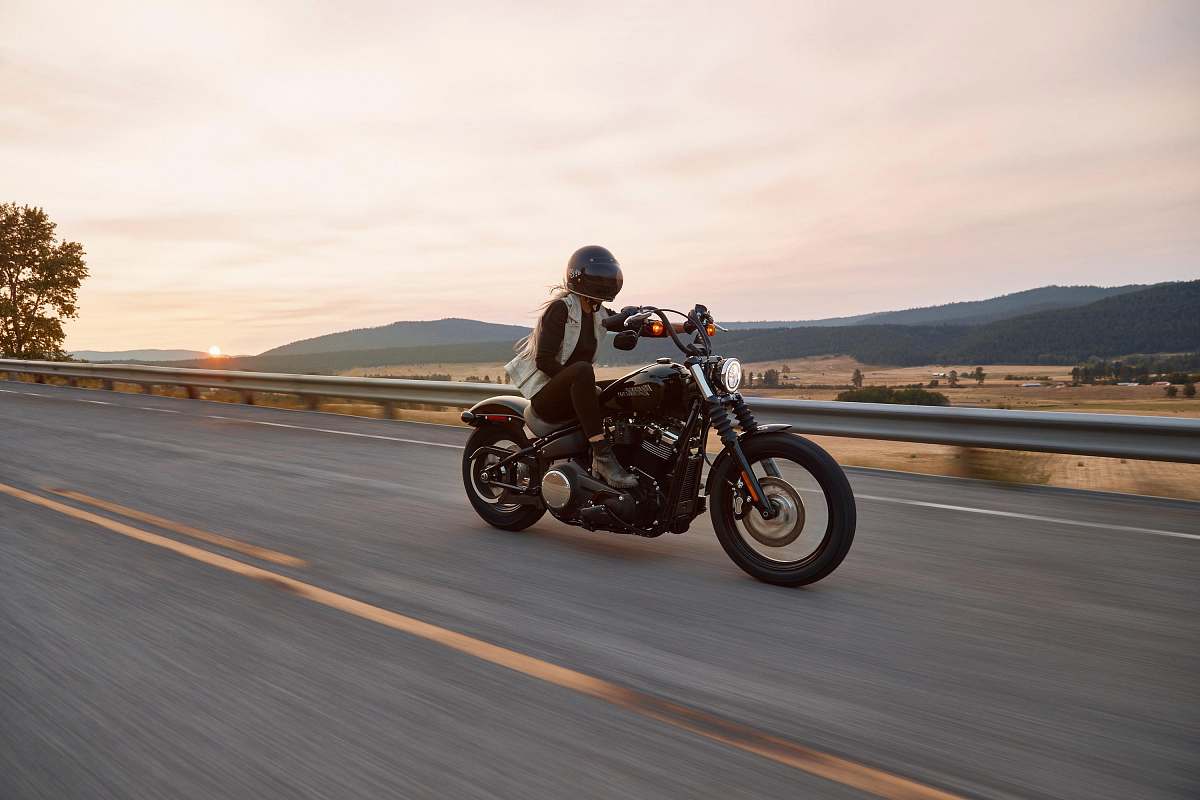 vehicle man on black cruiser motorcycle in highway transportation