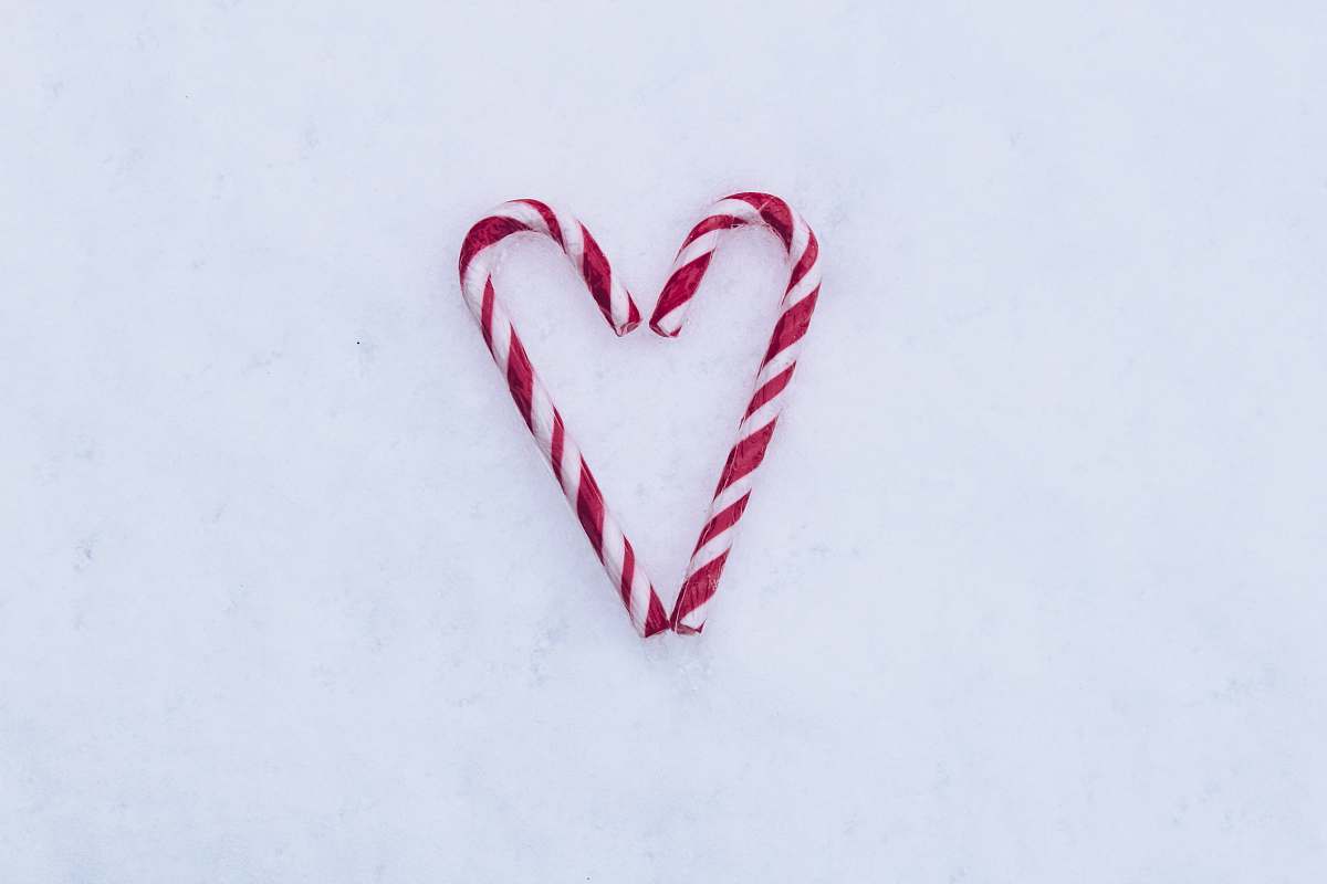 bomb two red-and-white candy canes on white surface dynamite