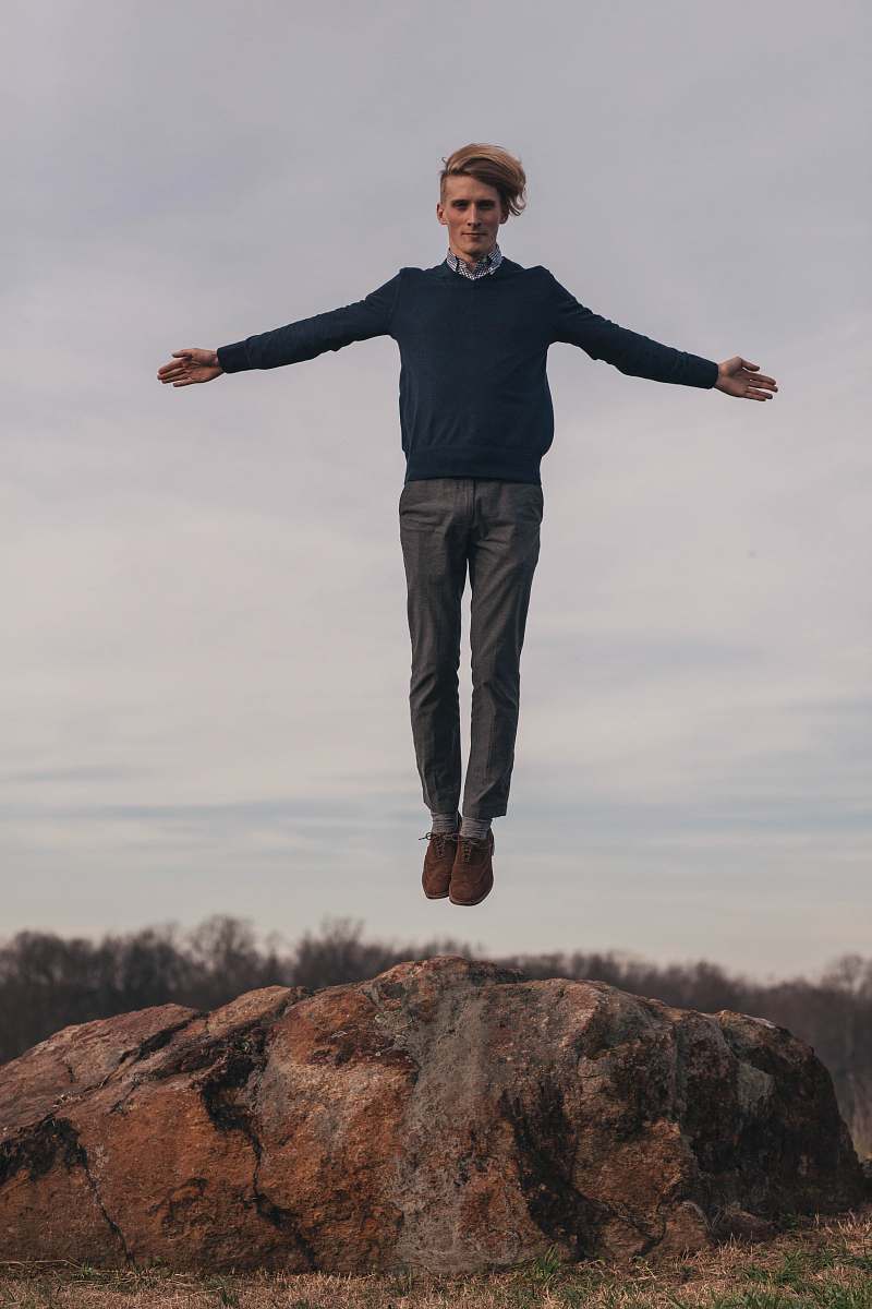 person man jumping while open arms human