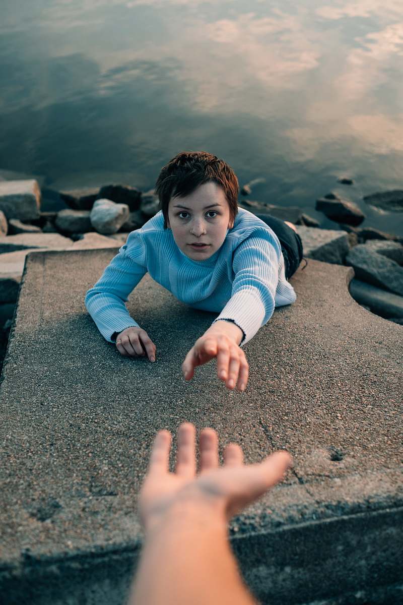 person-woman-reaching-hand-above-water-during-daytime-photo-human-image