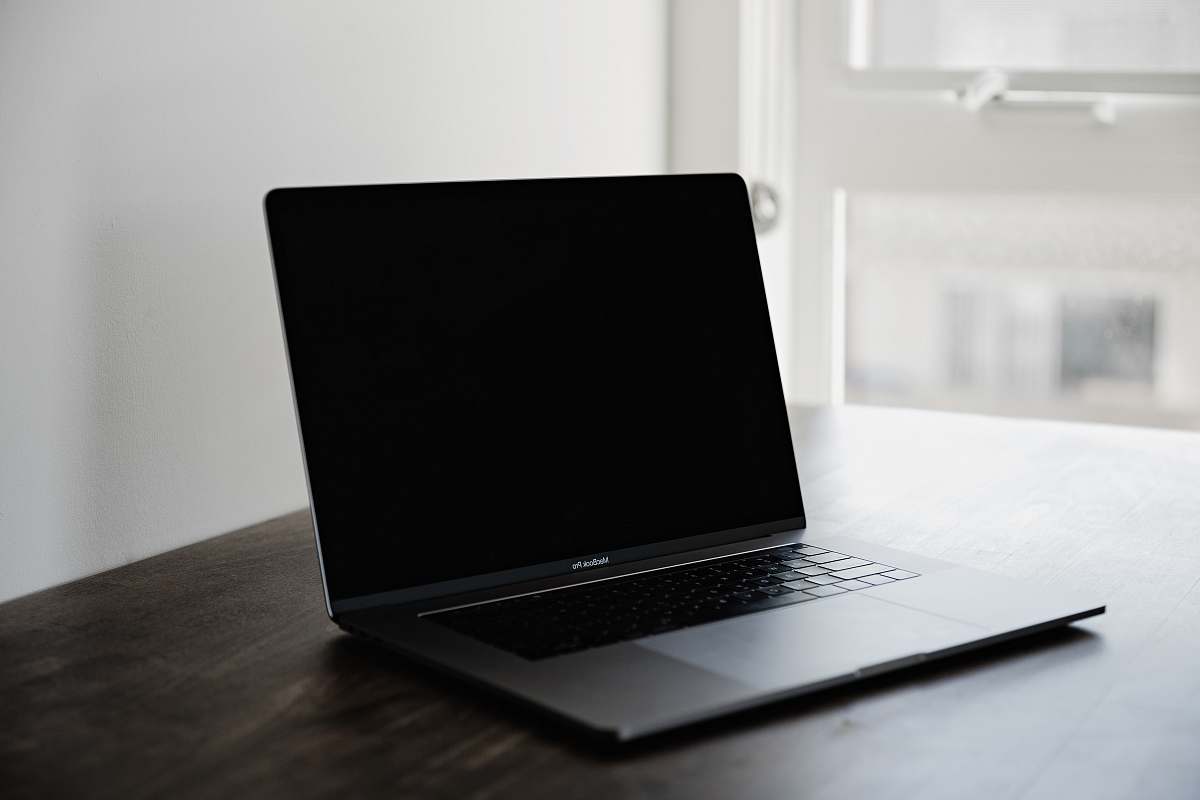  photo of black MacBook Pro on table 