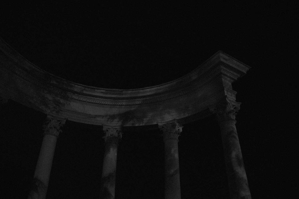 architecture white concrete pillar stand building under night sky building