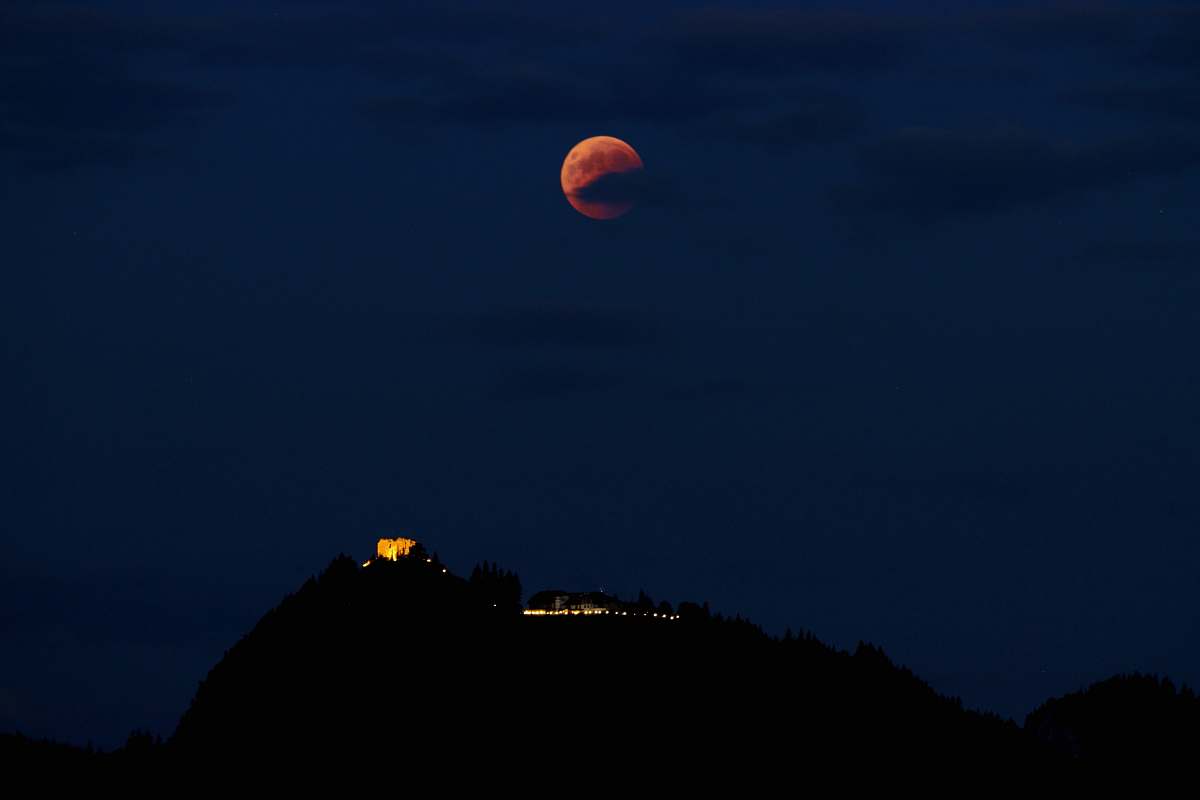nature silhouette photo of mountain under full moon outdoors