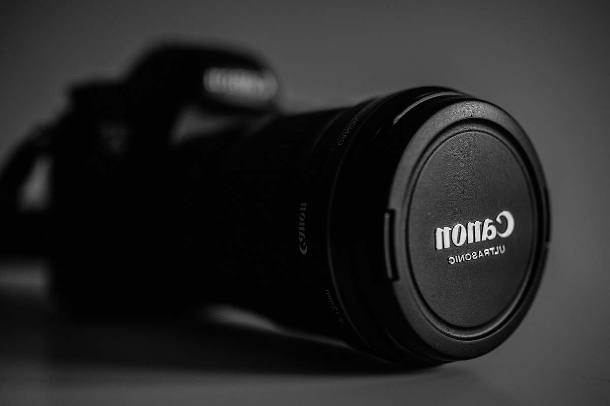 electronics selective focus photography of black Canon Ultrasonic DSLR camera black-and-white