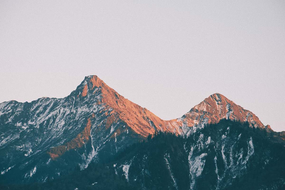 outdoors brown mountains under white sky mountain range