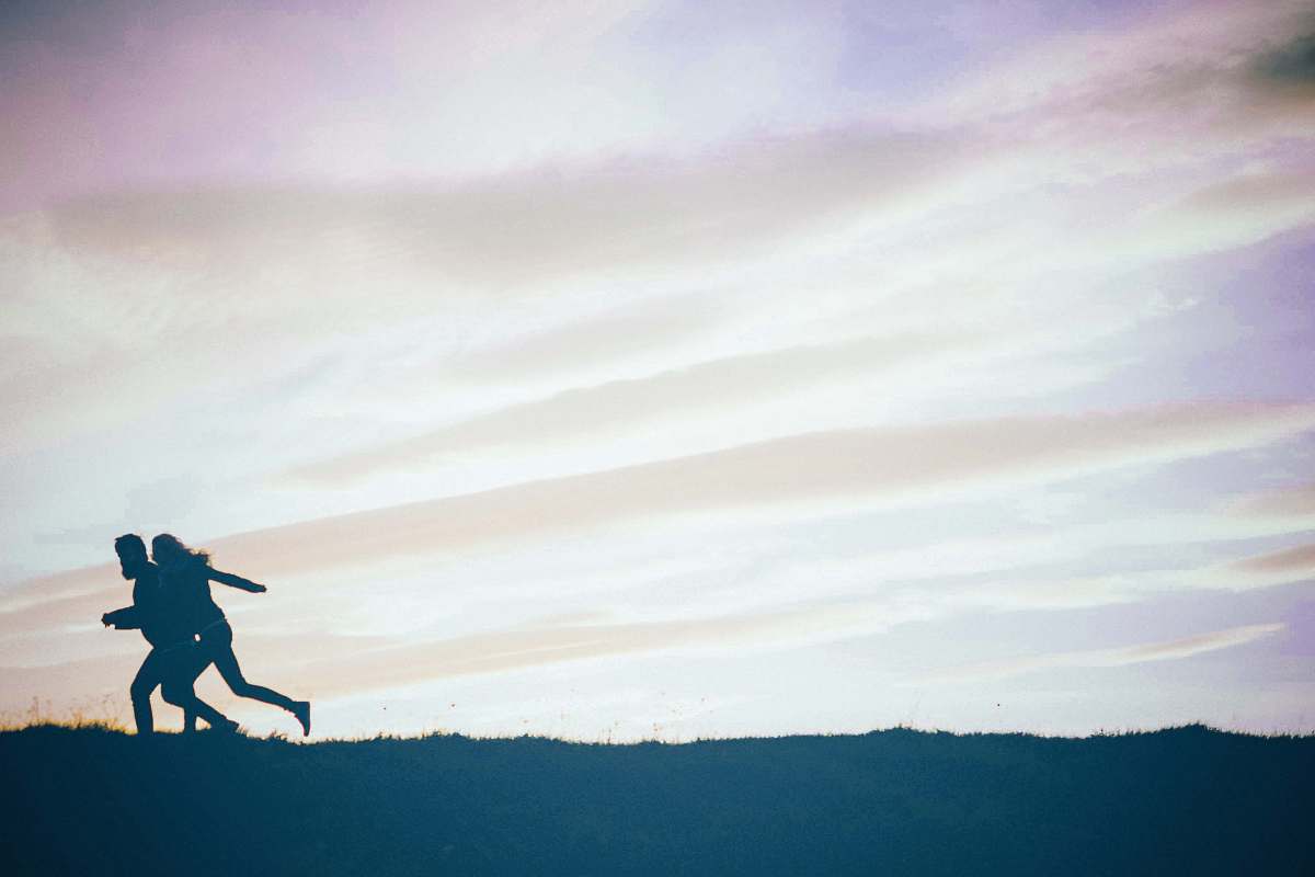 adventure person jumping on mountain during daytime leisure activities