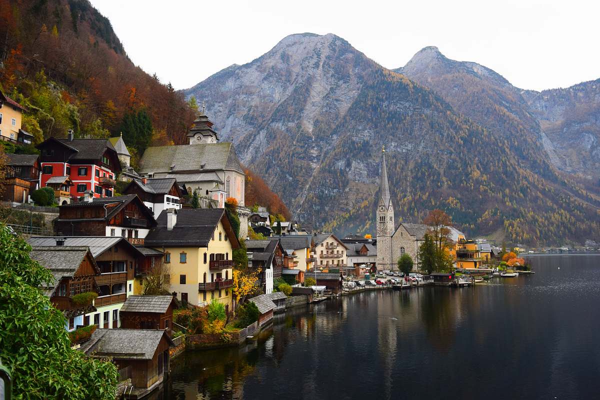 waterfront city beside body of water during daytime town