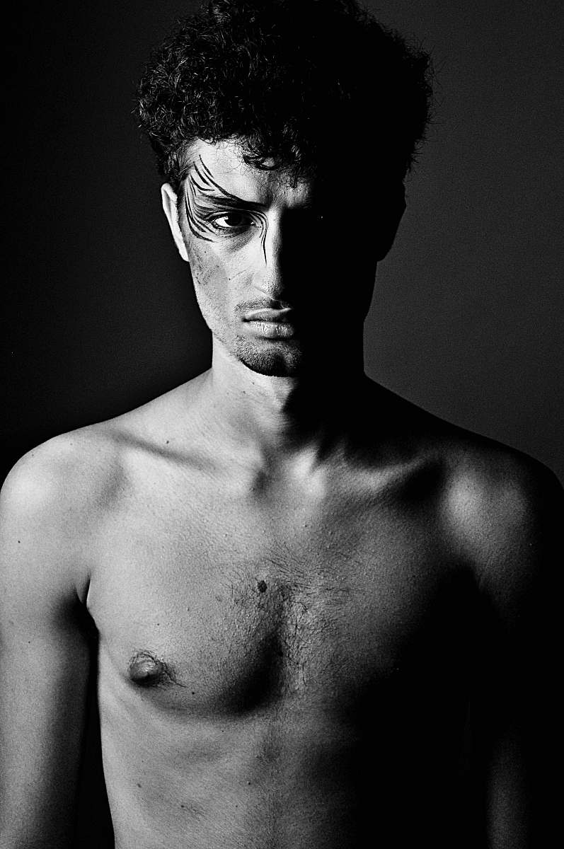 face grayscale photography of topless man human