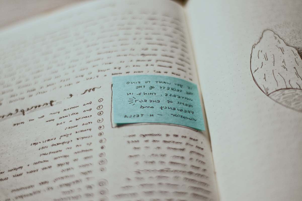 grey blue card on top of opened book vancouver