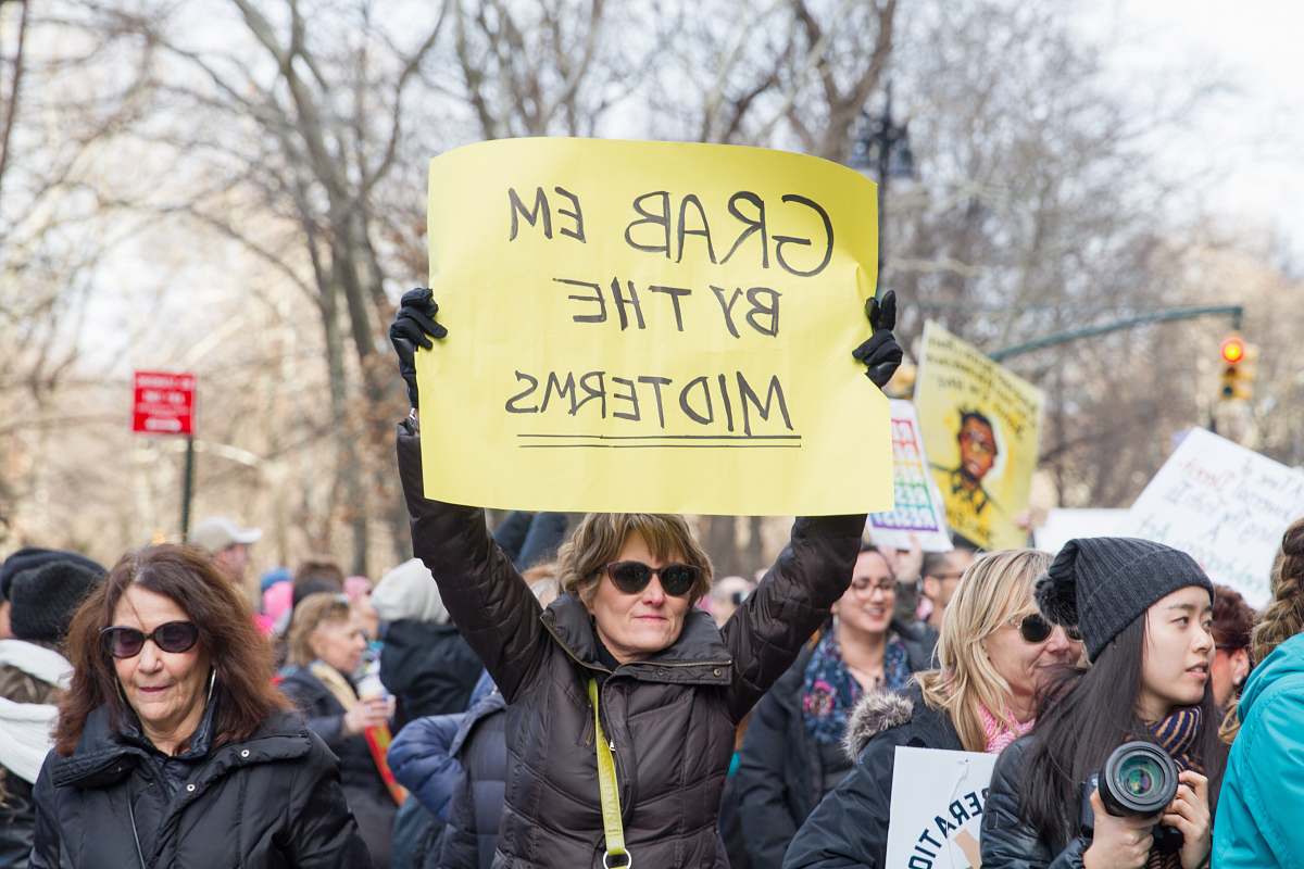 parade woman raise signage person