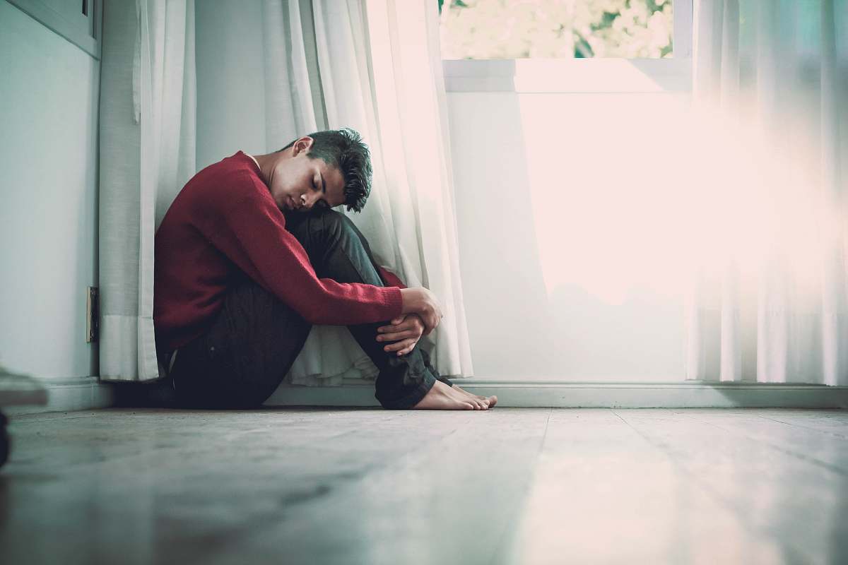 person man beside white frame window human