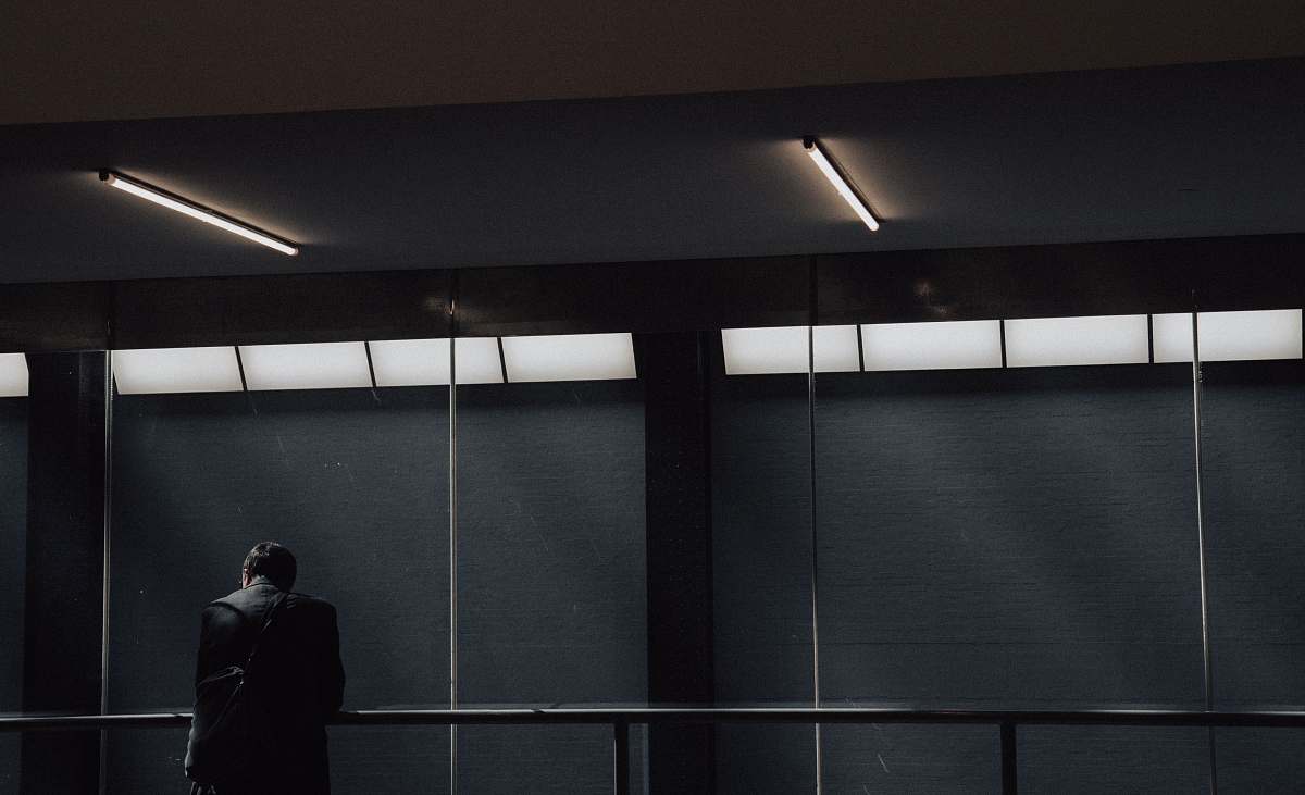 person man leaning on rail human