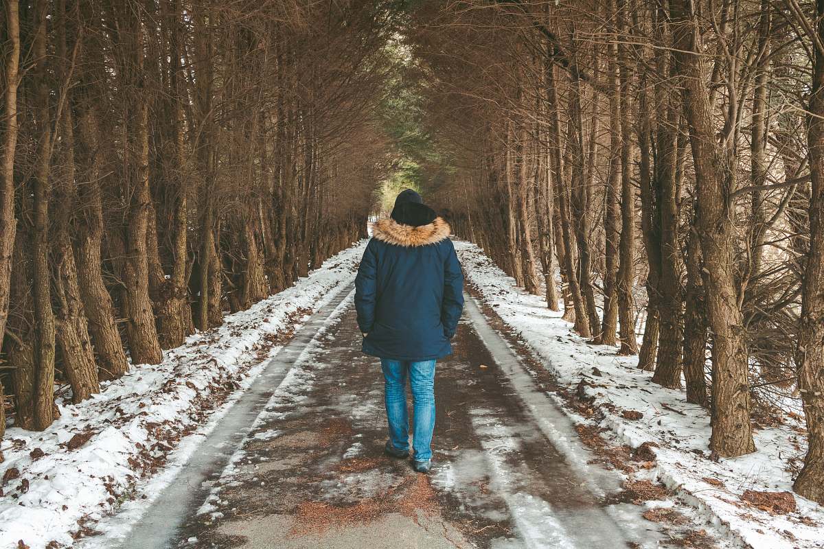 person person walking on road covered snow human