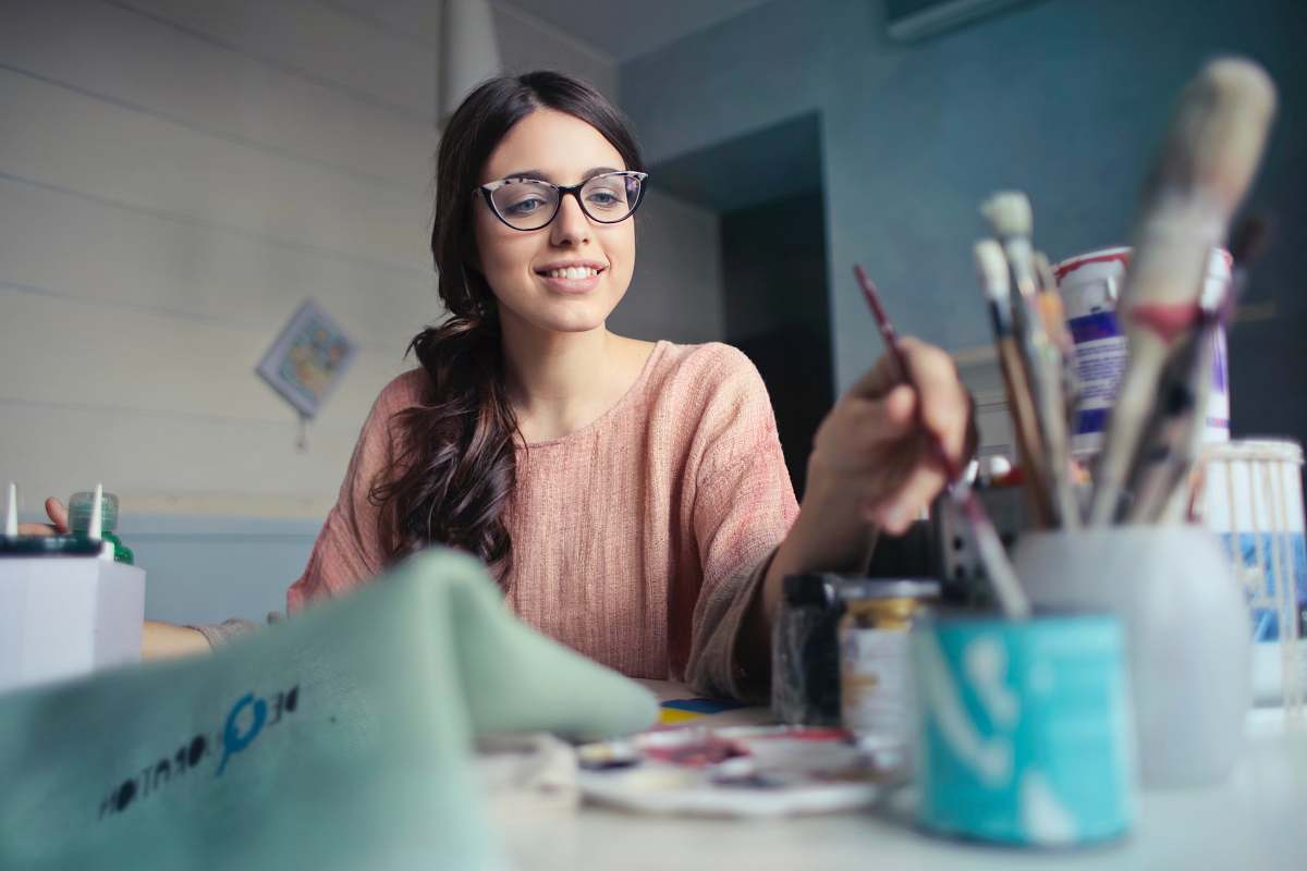 human woman holding paint brush people