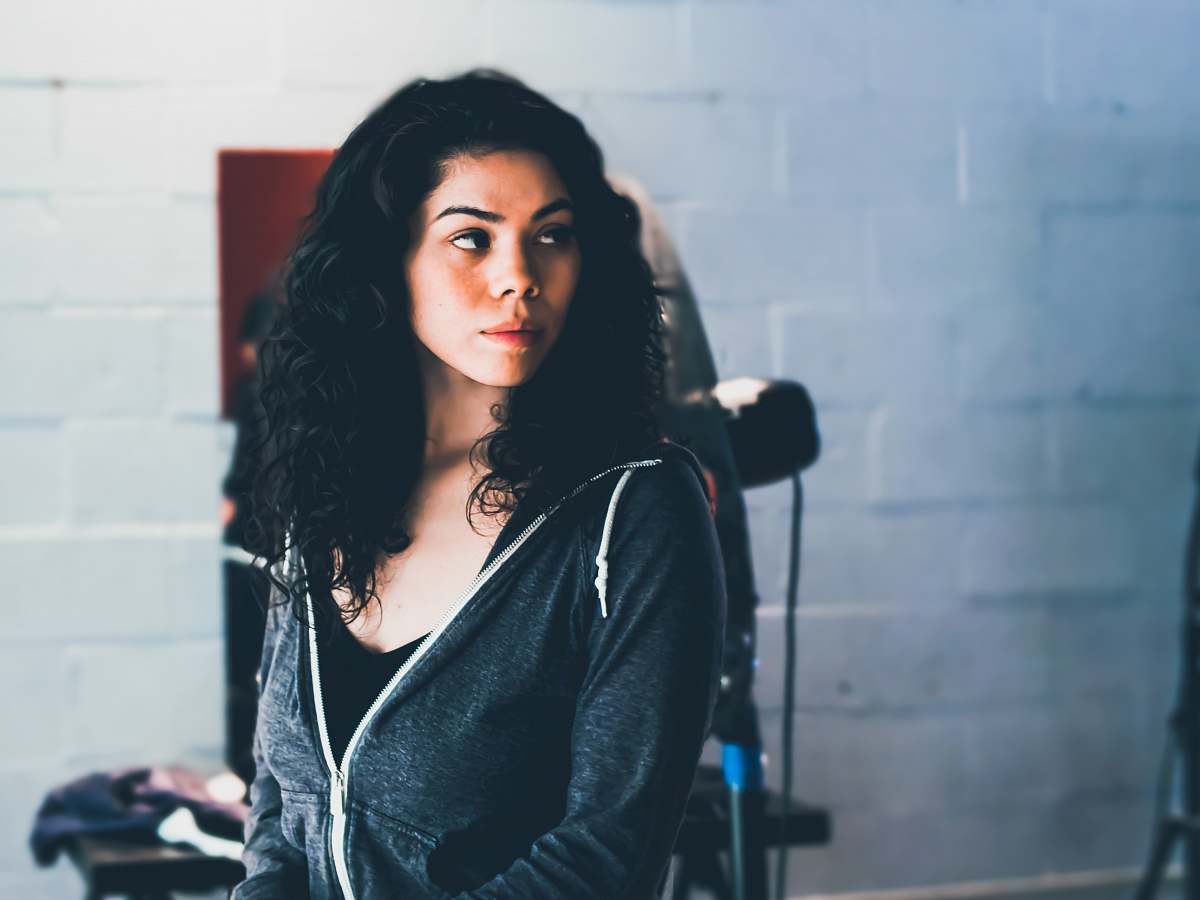 clothing woman standing near white wall sleeve