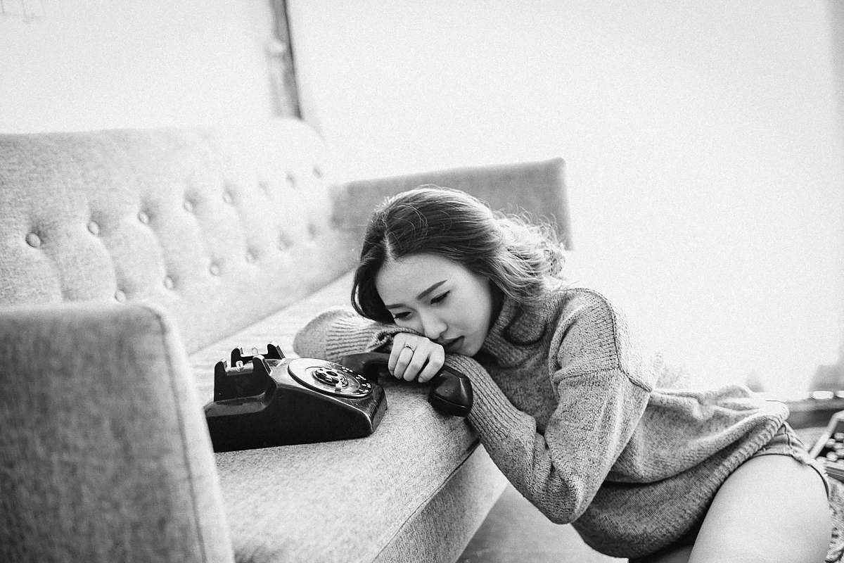 furniture woman sitting near the osfa couch