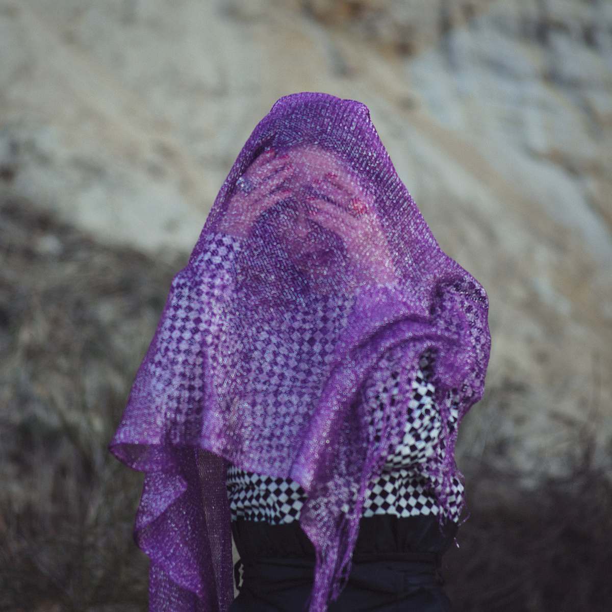 apparel selective focus photography of woman wearing purple scarf hat