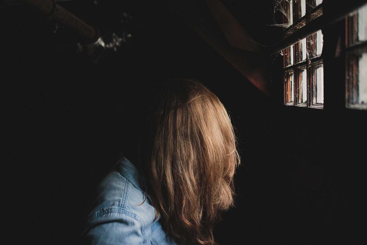 hair person sitting beside window girl