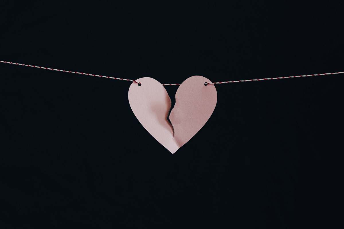 love broken heart hanging on wire broken