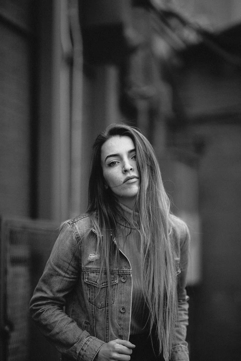 person grey scale photo of woman in jacket black-and-white