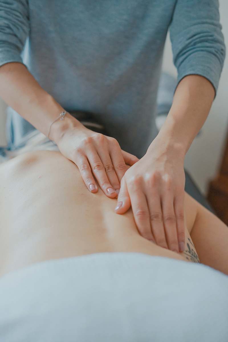 human man massaging woman's body massage