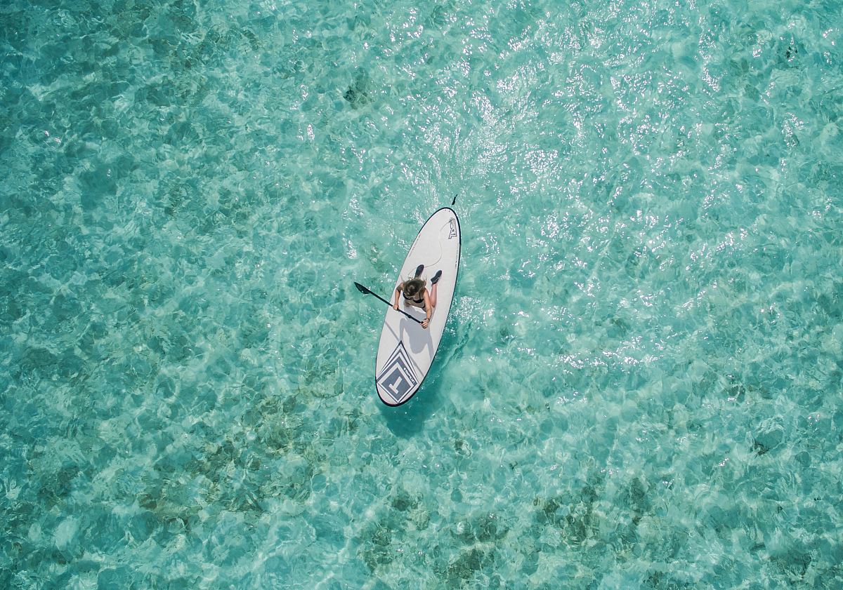 aerial photo of person using paddleboard
