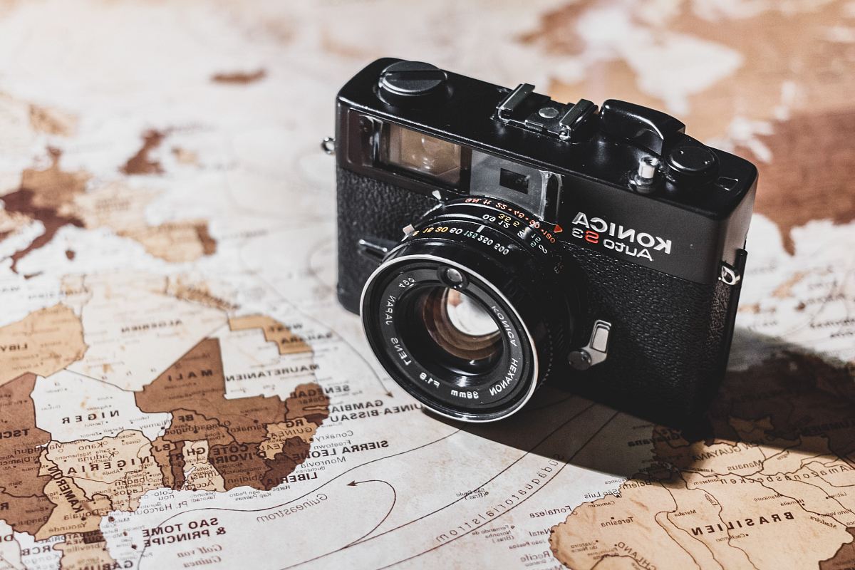 black Konica SLR camera on map