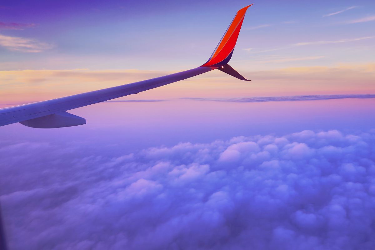 Person In A Plane Flying At High Altitude Taking Photo Of Left Airplane ...