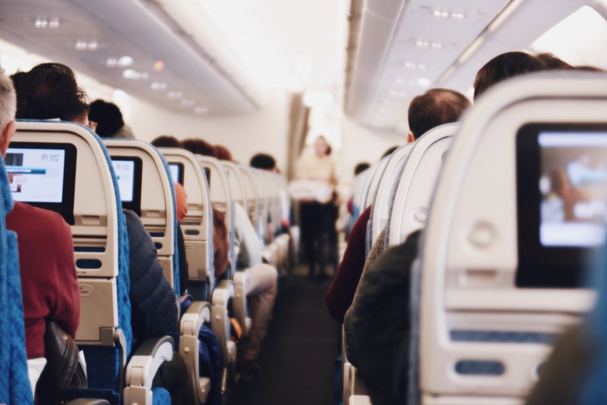 shallow focus photography of people inside of passenger plane