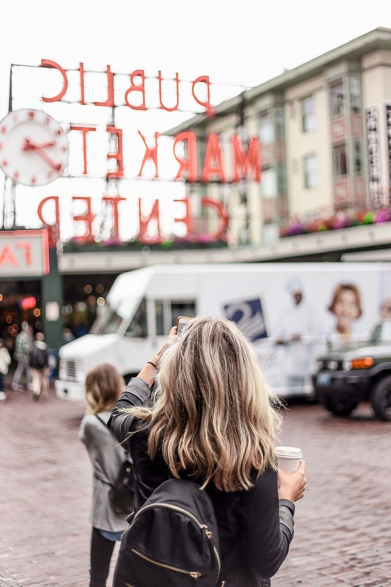 woman standing in front of Public Market Center