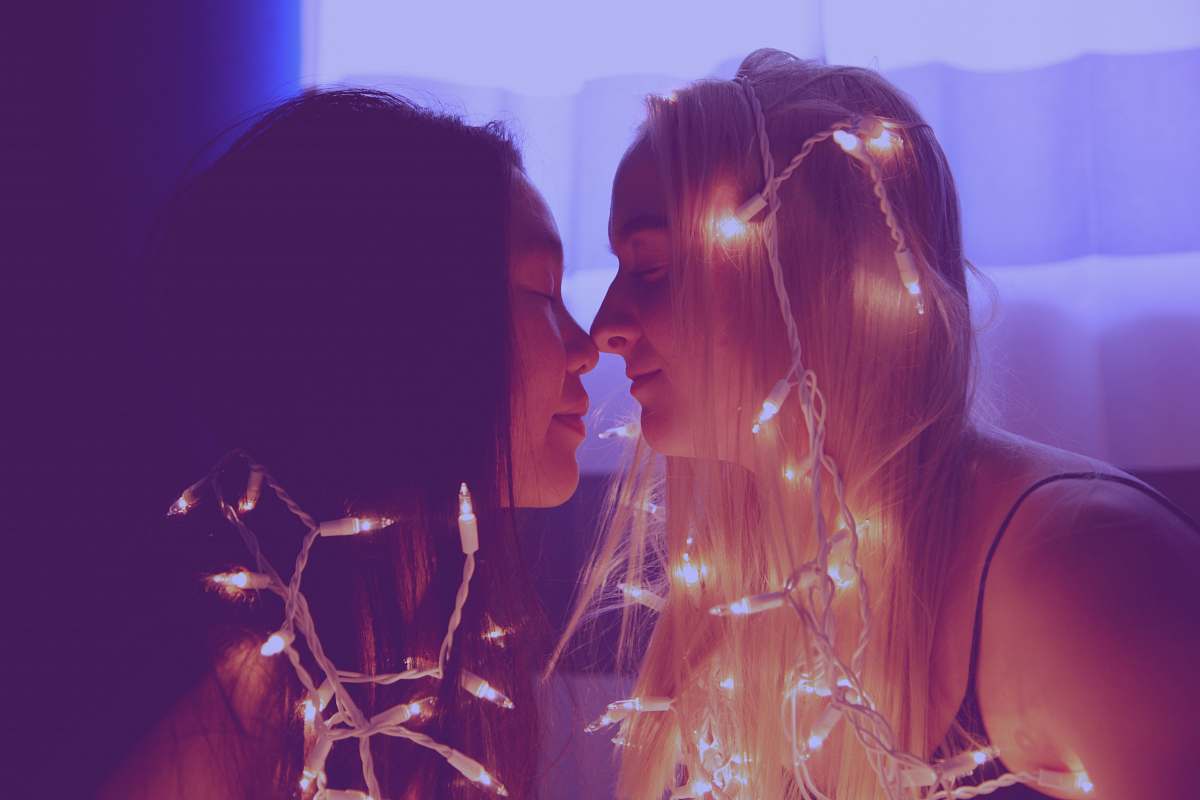 ogden two woman facing each other with string lights united states