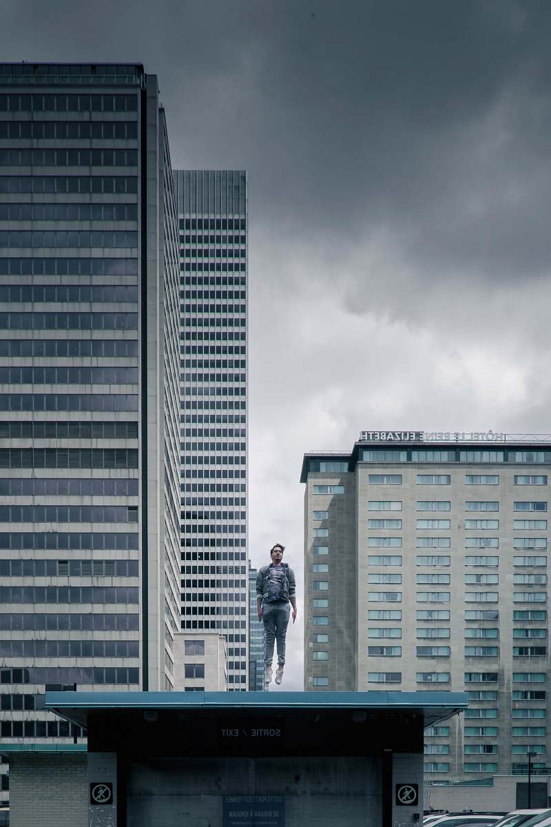 city man on top of a establishment building