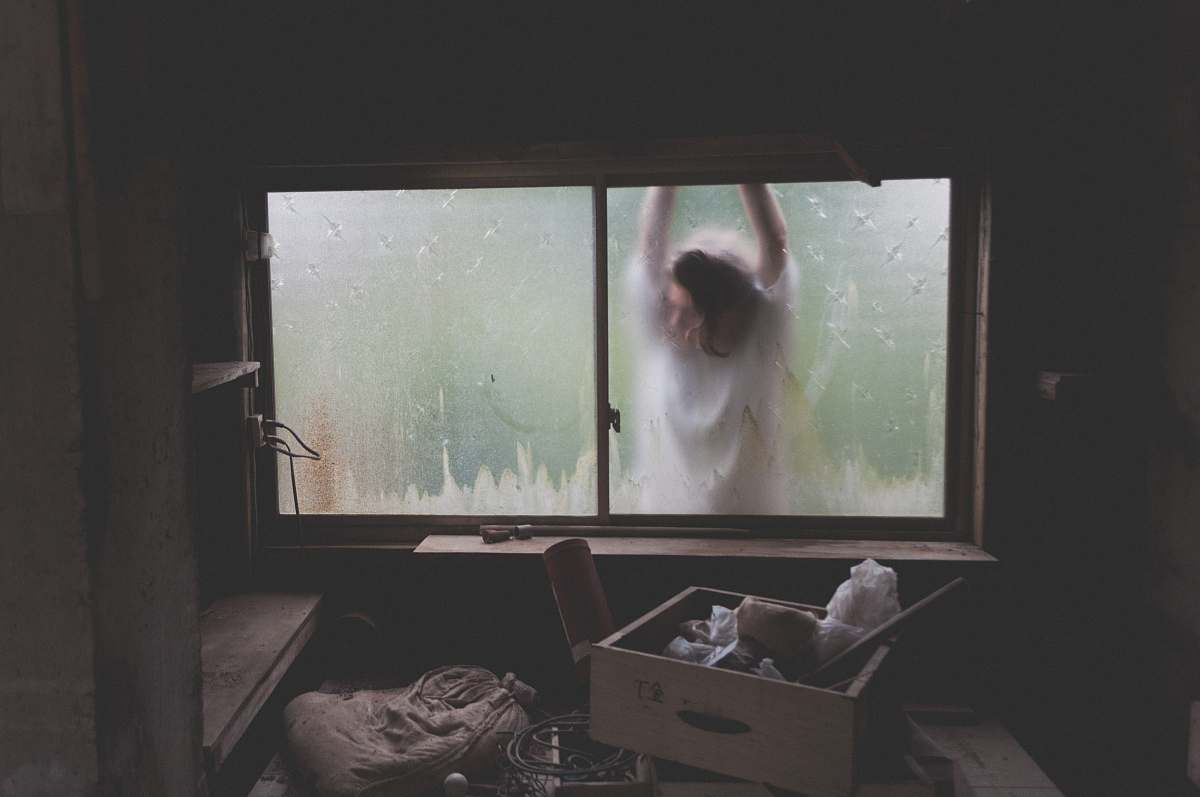box woman leaning on window storage