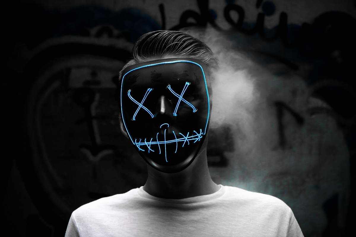 person grayscale photo of man wearing mask people