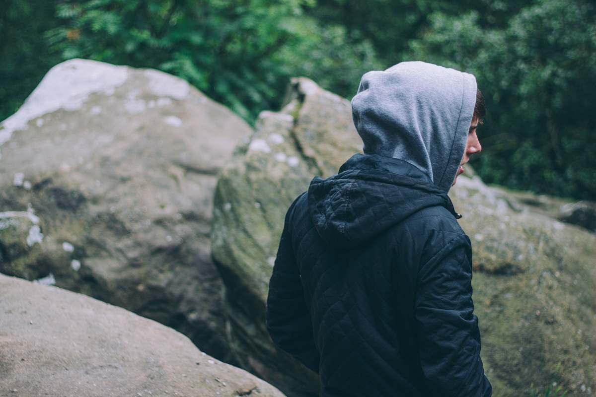 person person in black hoodie near gray rocks united kingdom