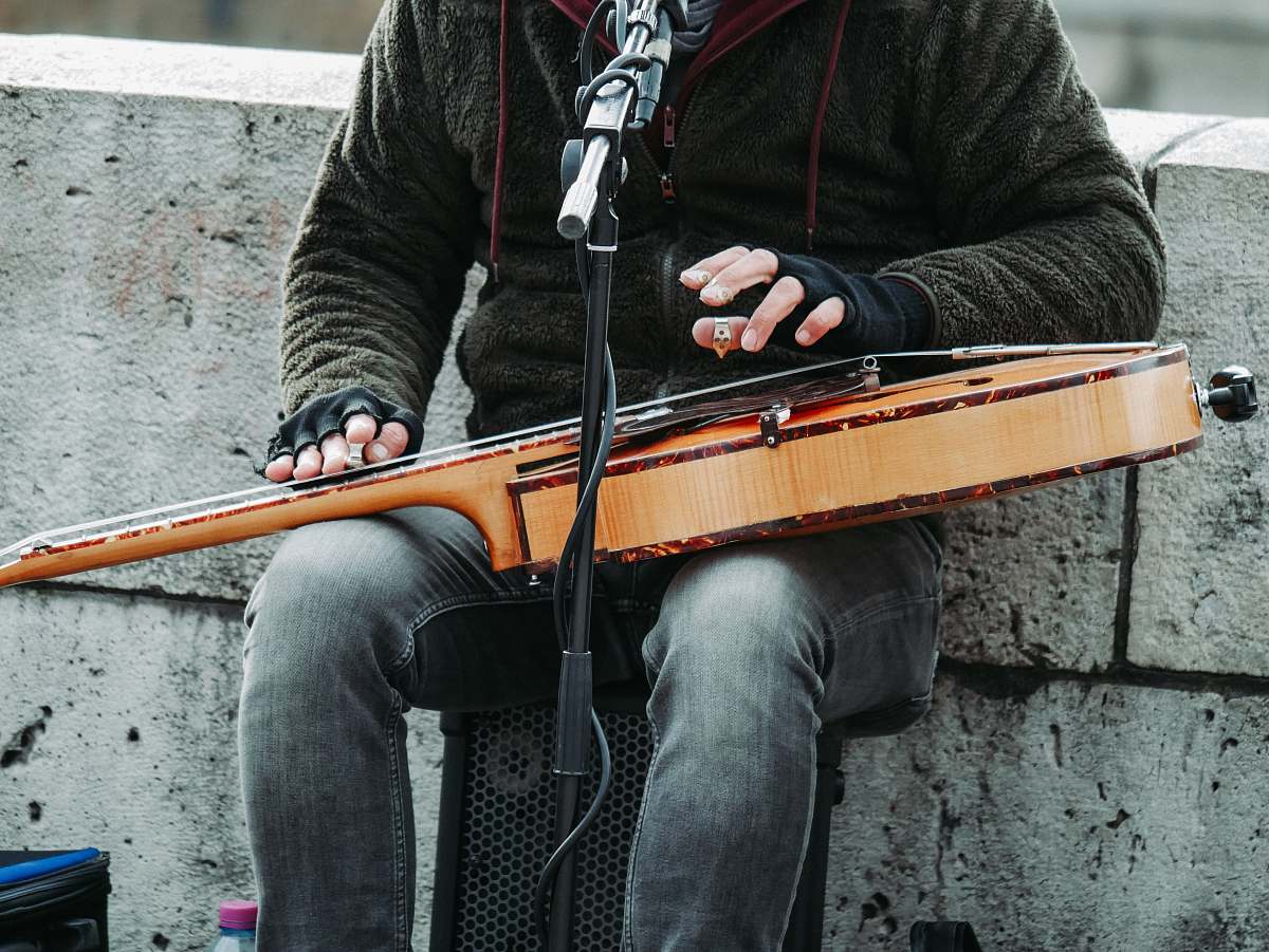 person person playing guitar white singing musical instrument
