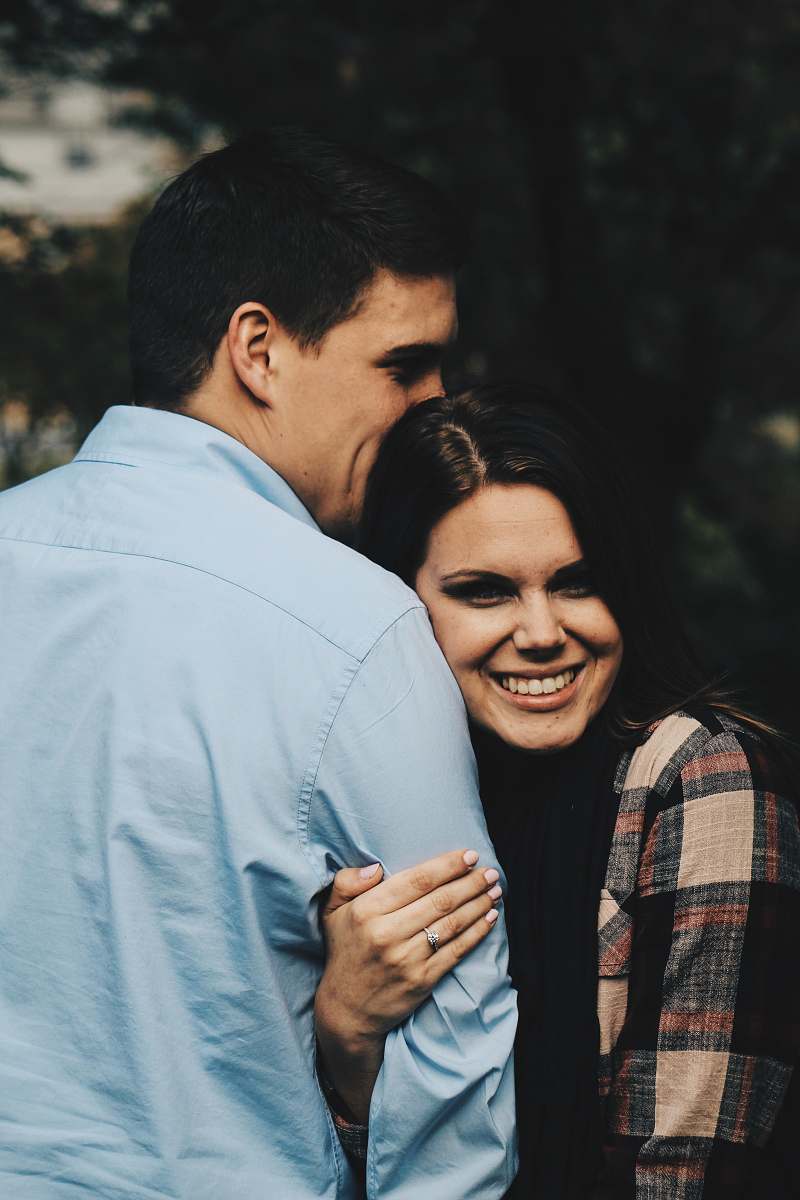 people woman holding arms of man person
