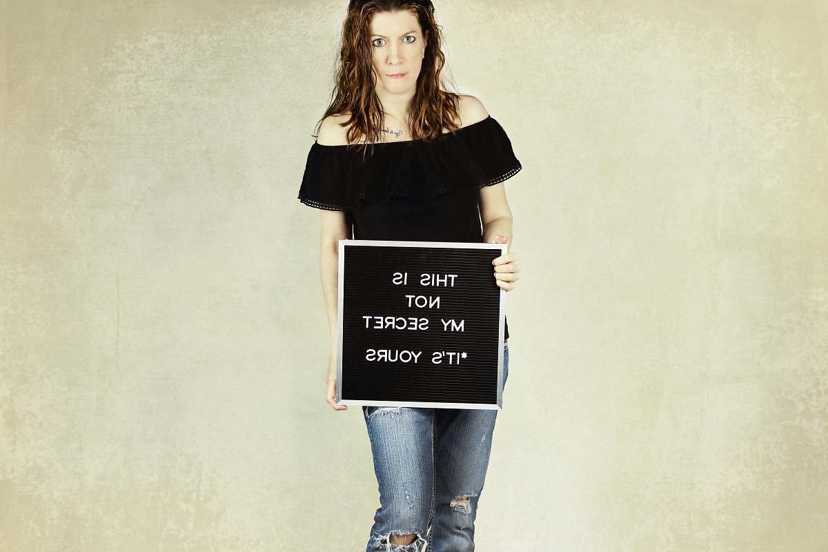clothing woman holding signage apparel