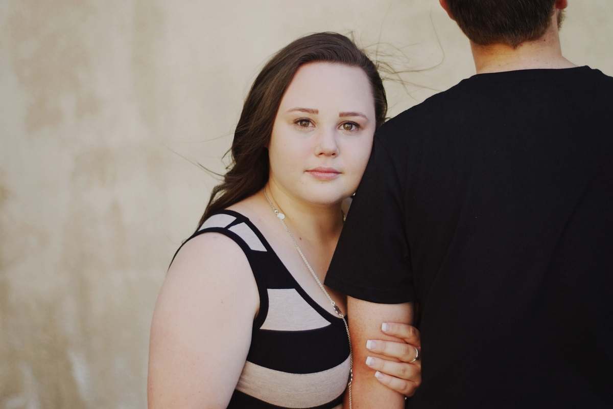 people woman hugging man's arm person
