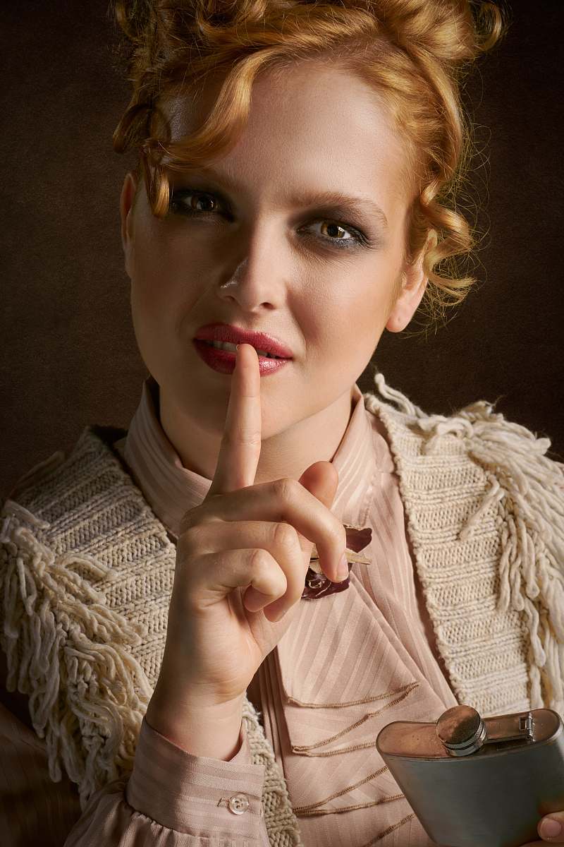 person woman in brown top finger