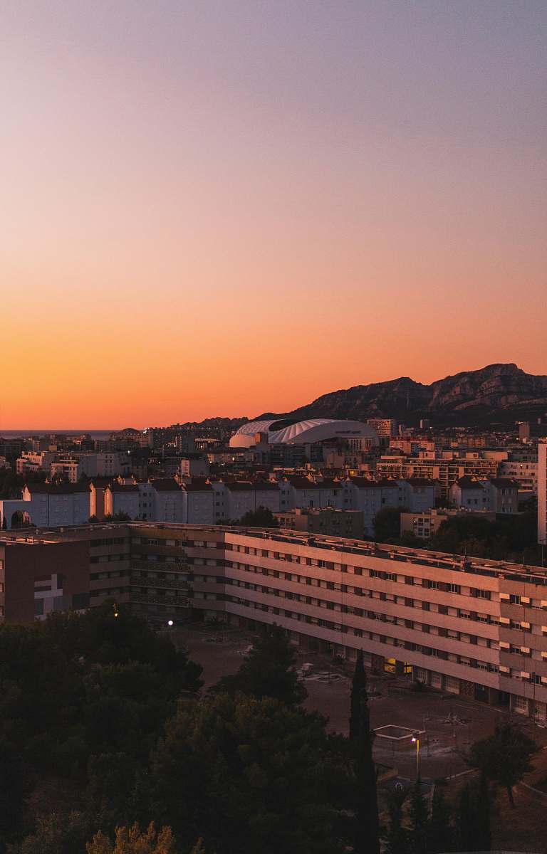 landscape gray concrete buildings during golden hour outdoors