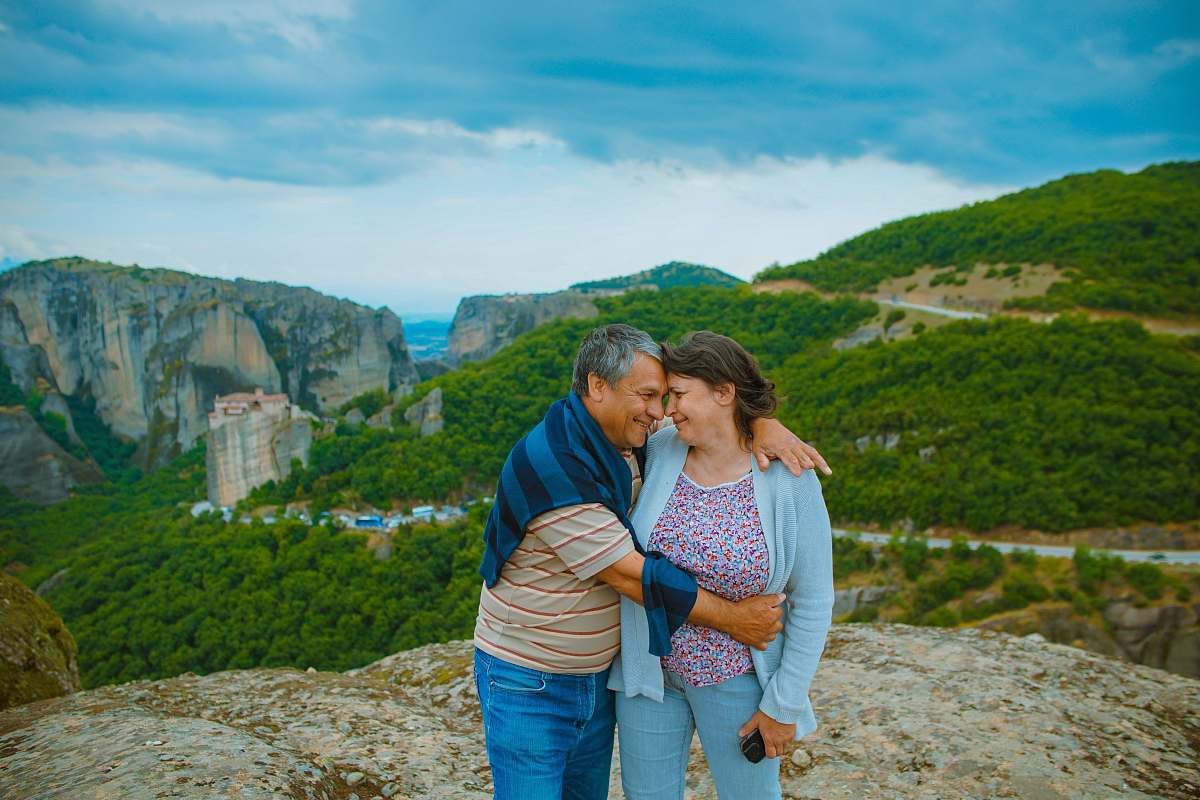 person man embracing the woman on top of hill human